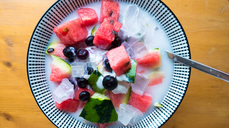 Bowl of hwachae with blueberries, ice and watermelon