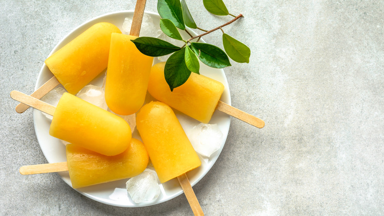 Frozen popsicles on a plate with ice 