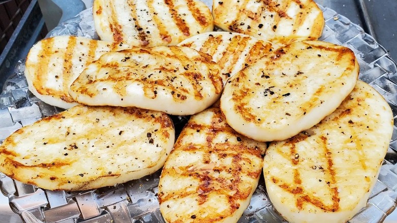 Close-up of a plate of grilled calamari steaks