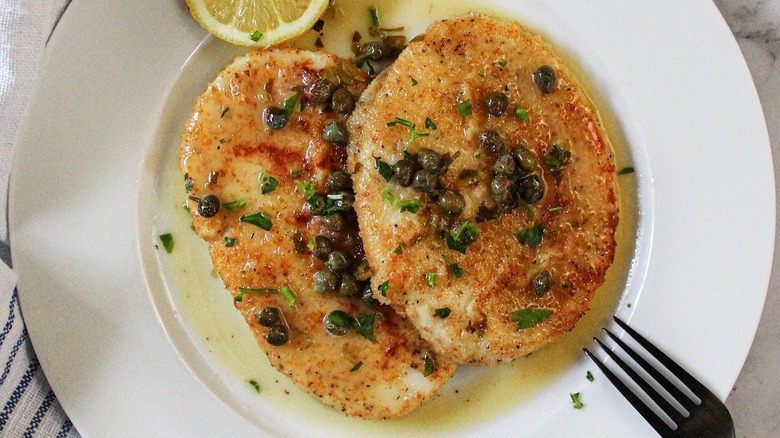 Pan-fried breaded calamari steaks with lemon caper sauce