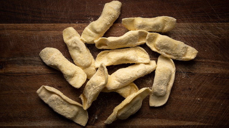 Uncooked casoncelli dusted with flour 