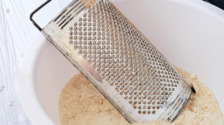 grater in a bowl of fresh breadcrumbs