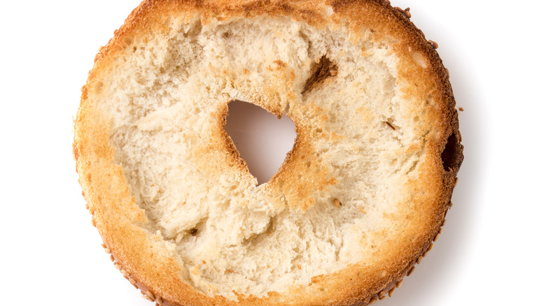 closeup of toasted bagel with insides scooped out