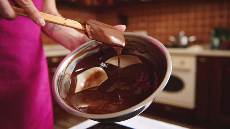 tempering melted chocolate on bowl