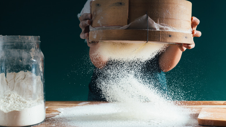 Sifted flour onto a table