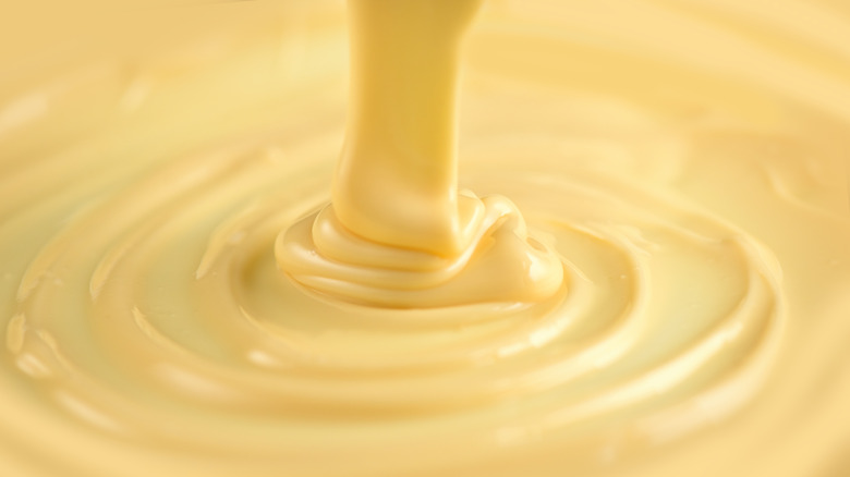 Pouring melted white chocolate