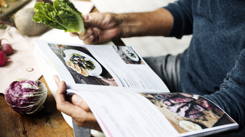 person reading a cookbook