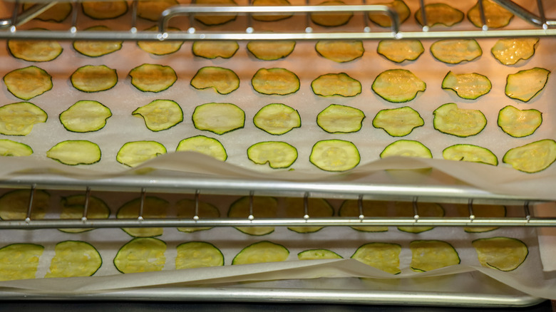 Baking trays of roasting zucchini