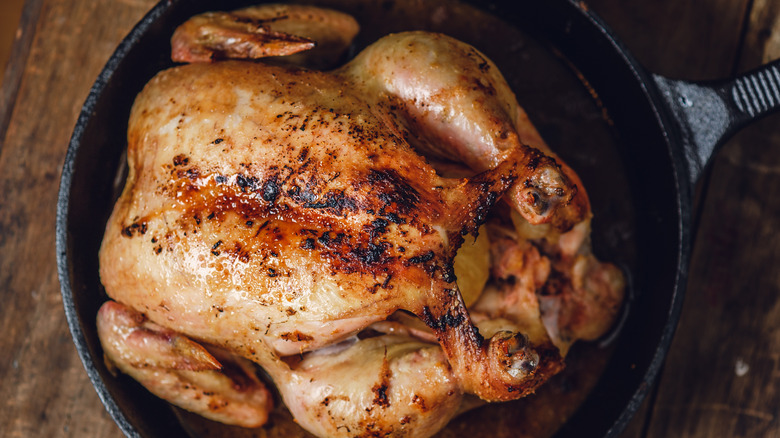 whole roasted chicken in cast iron pan