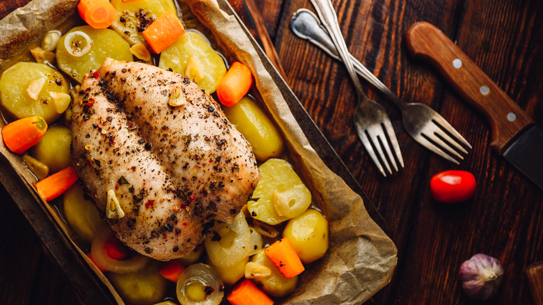 chicken on sheet pan with carrots and potatoes