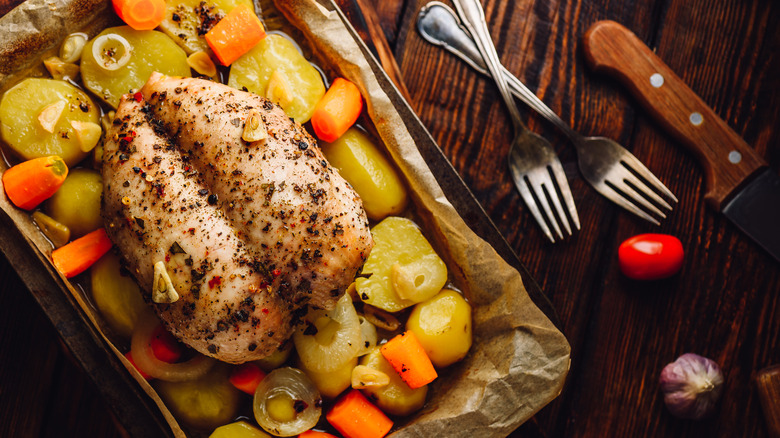 chicken on sheet pan with carrots and potatoes