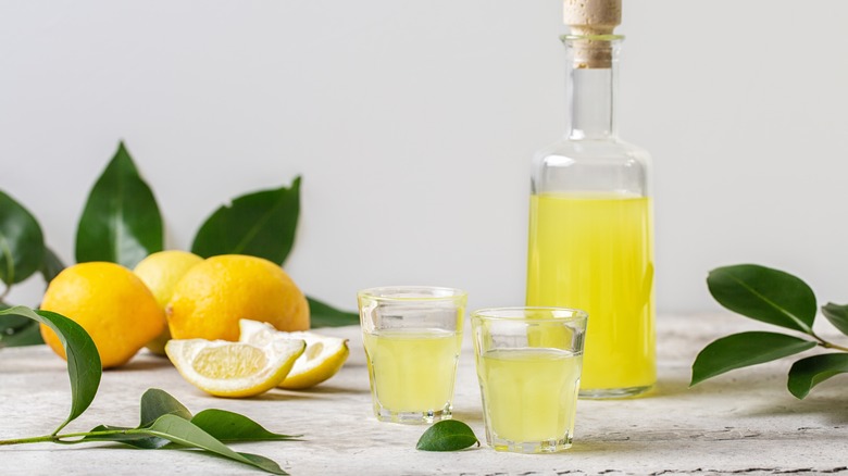 limoncello bottle and shot glasses