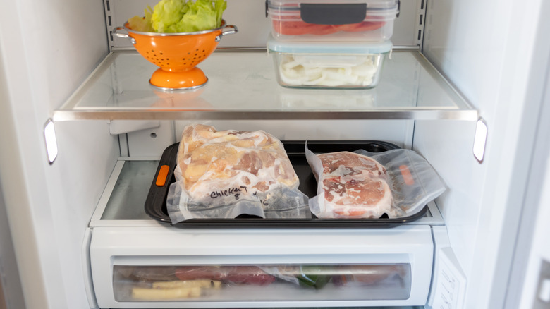 frozen meat defrosting in the refrigerator