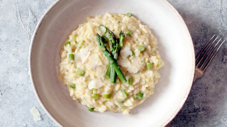 risotto topped with parmesan and asparagus