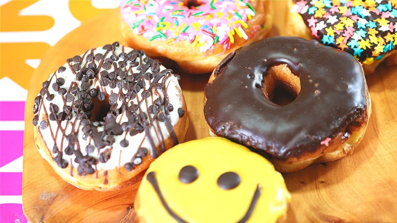 Dunkin Donuts on a wood platter