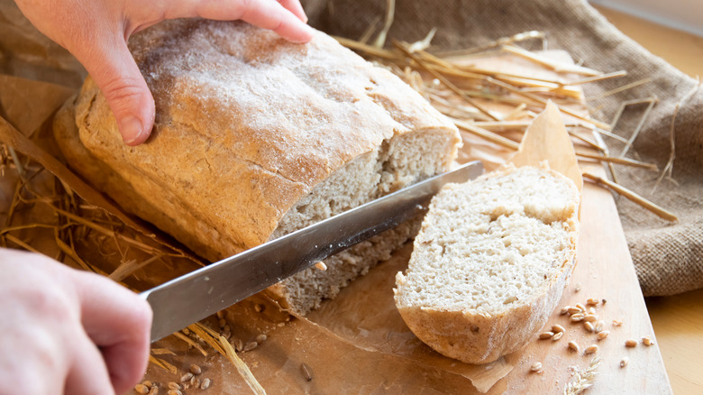 cutting loaf of bread into chunks