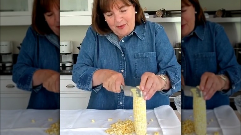 Ina Garten cutting kernels off a corn cob