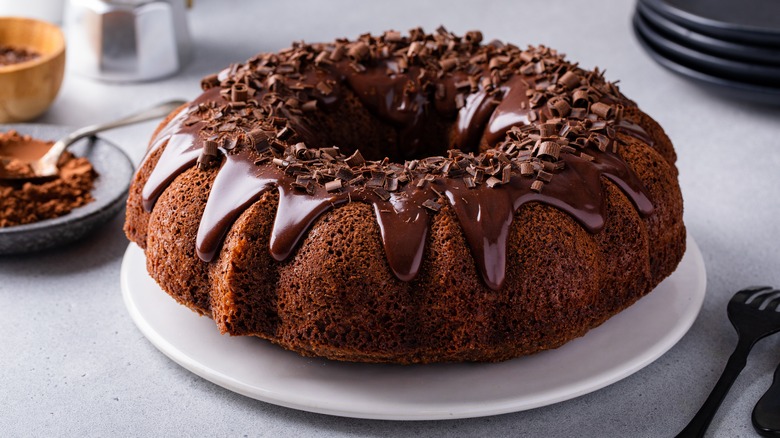 Chocolate bundt cake decorated with chocolate drip and shavings