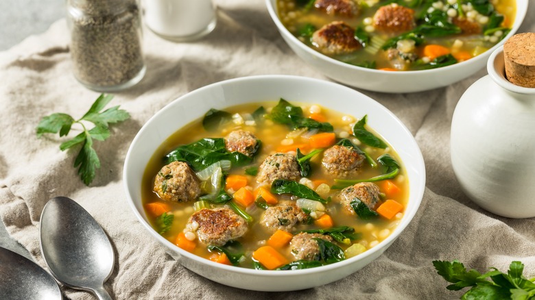 Bowl of Italian wedding soup made with spinach