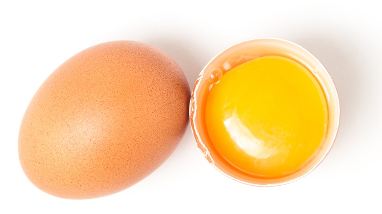 cracked egg showing the yolk