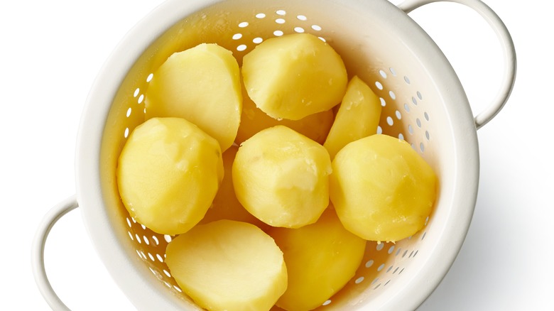 Boiled potatoes in colander