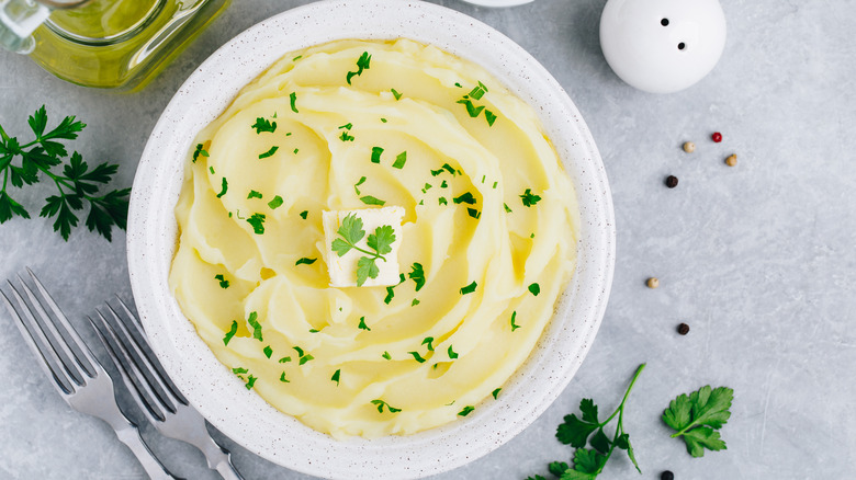 mashed potatoes with a pat of butter and sprinkle of parsley