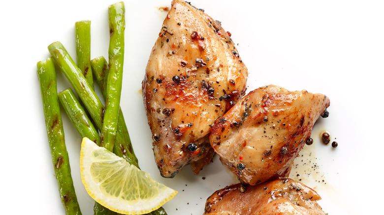 roasted, skin-on chicken breast with asparagus and lemon