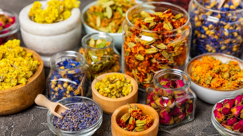 Jars of assorted dried flowers