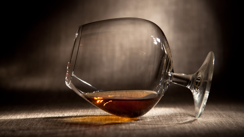 Tilted snifter of cognac
