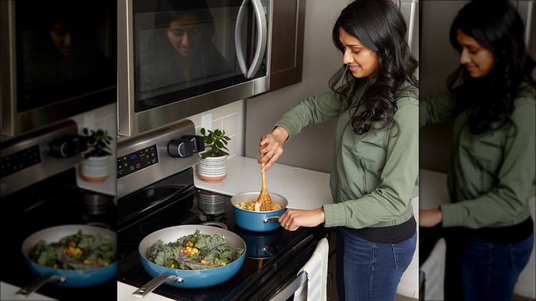 Inirv Ome founder Akshita Iyer cooking at stovetop