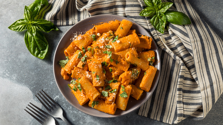 Vodka rigatoni pasta with cheese and basil