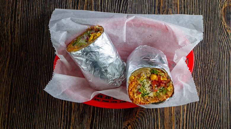 Halved burrito wrapped in foil