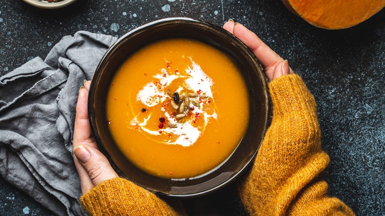 a bowl of creamy pumpkin soup