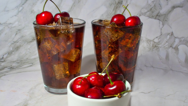 Two Roy Rogers drinks with cherries