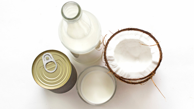 Coconut milk in can, jar, and coconut