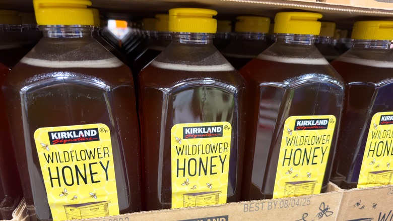 Kirkland Signature Wildflower Honey bottles in cardboard boxes