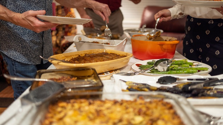 Guests serving themselves at potluck