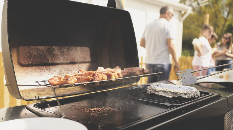 Meat cooking on outdoor griddle