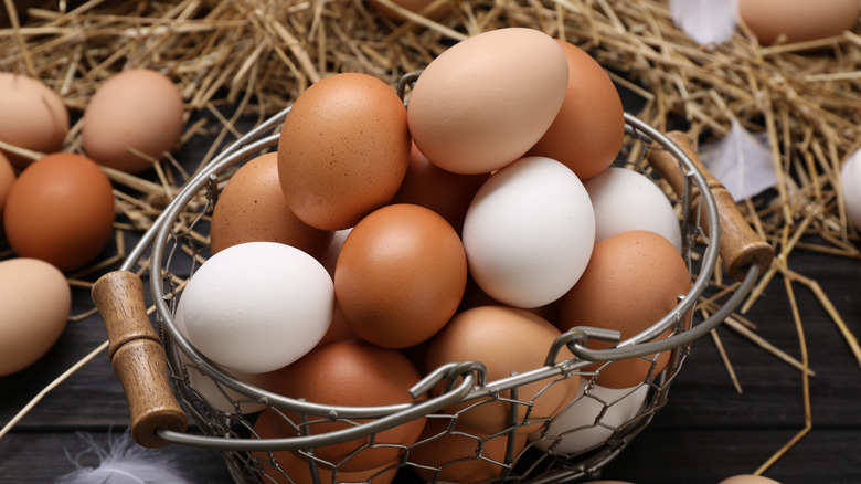 A basket full of brown and white eggs