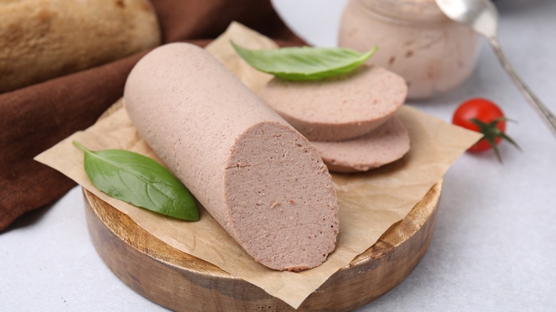 Liverwurst sausage sliced on cutting board