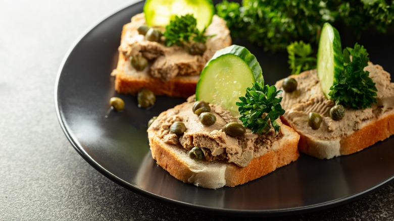 Pâté on bread with cucumber and capers