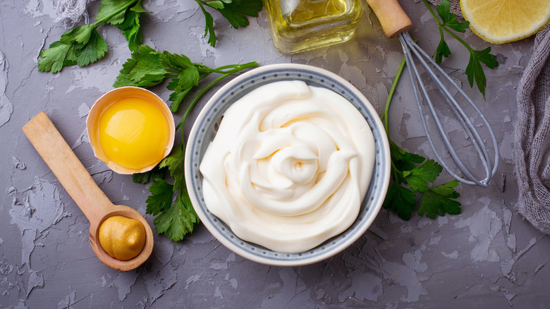 Bowl of mayonnaise next to ingredients