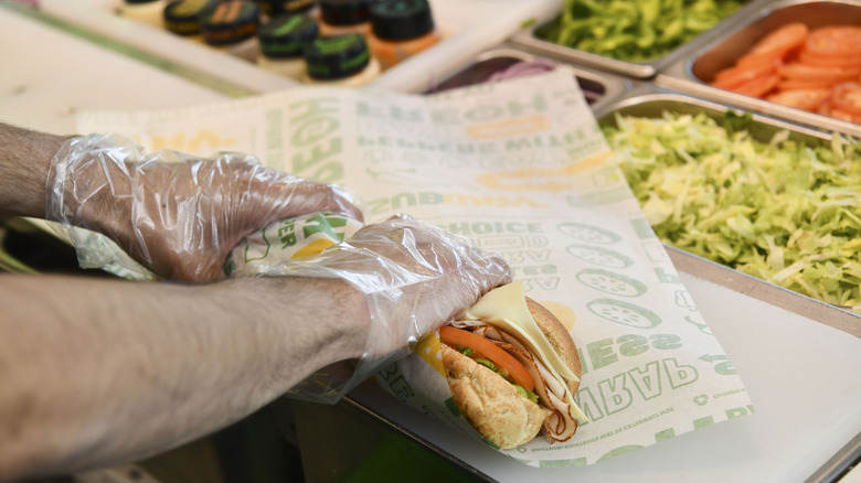 Subway sandwich being wrapped