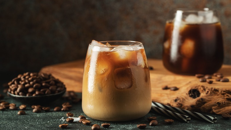 Iced coffee in glass with coffee beans