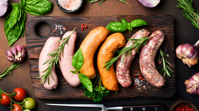 different kinds of sausages on cutting board