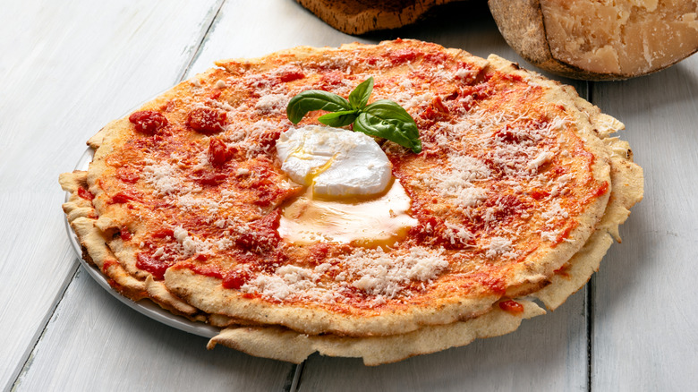 Pane frattau garnished with a sprig of basil