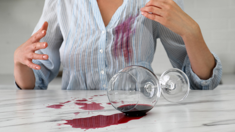 Spilled red wine and wine-stained shirt