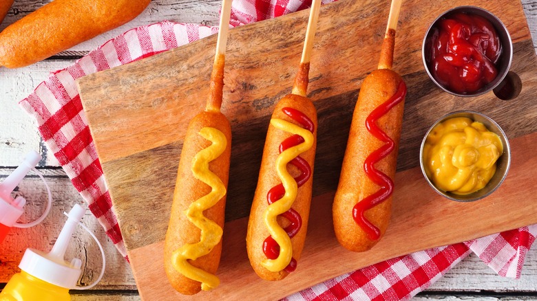 corn dogs with ketchup and mustard