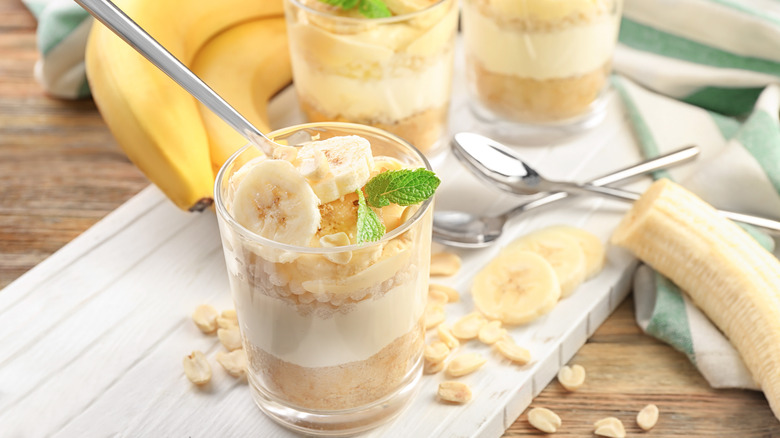 Banana pudding with peanuts in glass cups