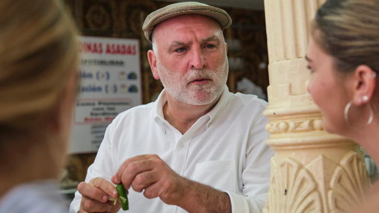Chef José Andrés holding tiny pickle